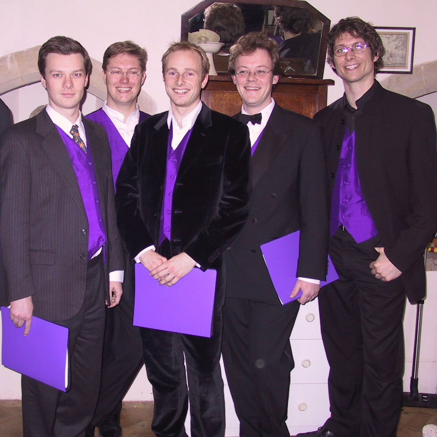 Five singers of TONUS PEREGRINUS in concert dress with purple waistcoats